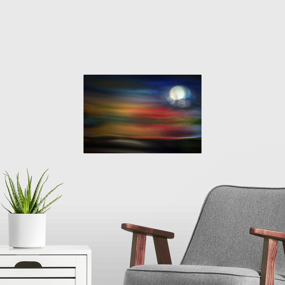 A modern room featuring Abstract photograph of blurred and blended colors and flowing lines with a glowing moon.