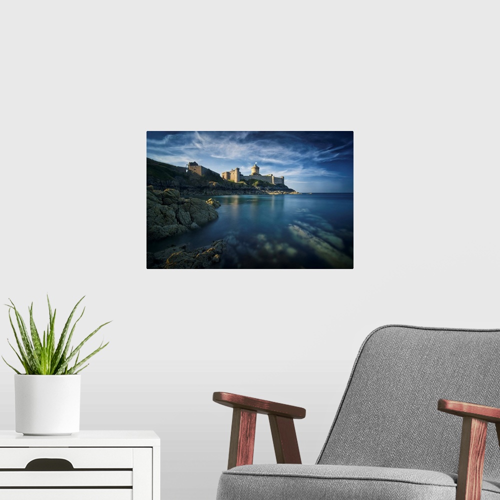 A modern room featuring Classical view of a castle facing the sea and the rock, the place of Fort la Latte, in Brittany i...