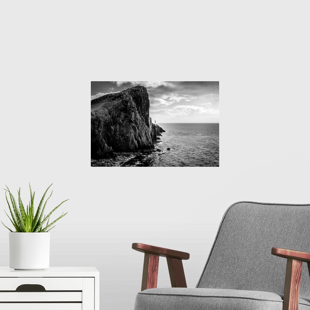 A modern room featuring Fine art photo of a rocky cliff overlooking the ocean.