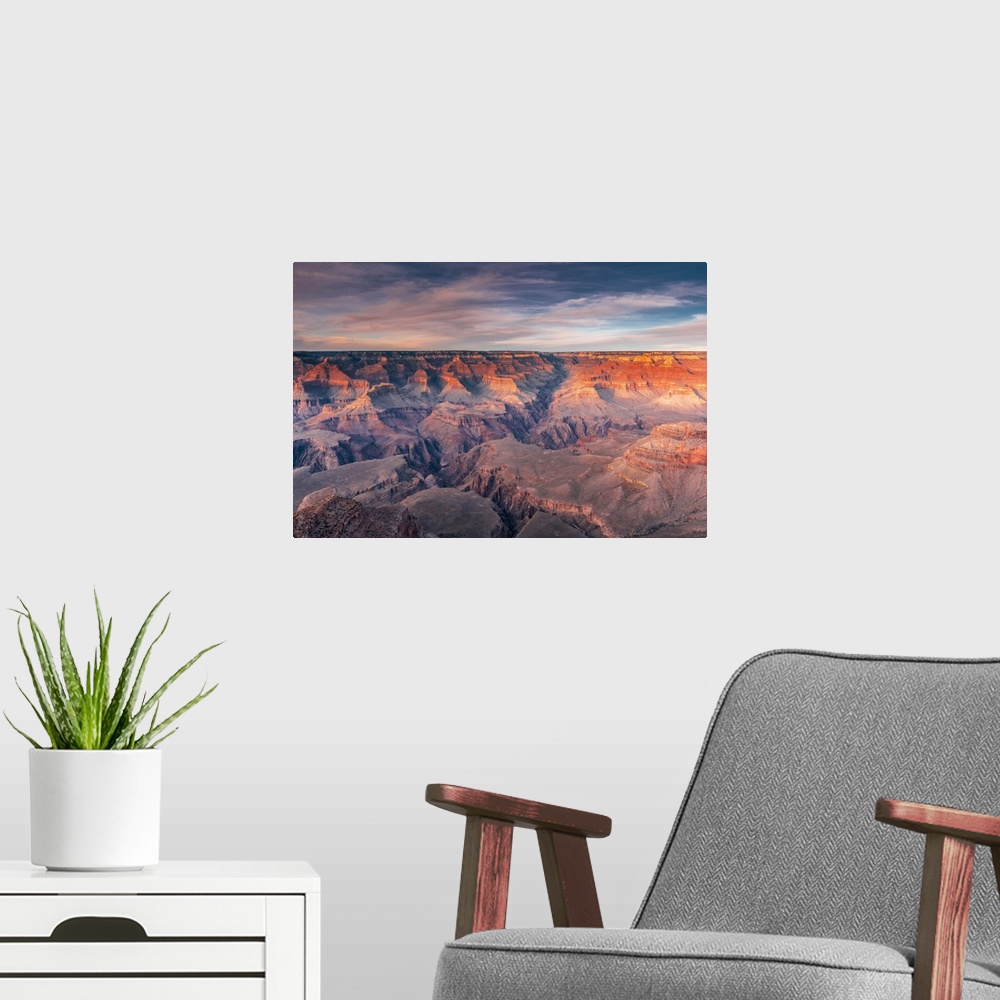 A modern room featuring Layered bands of red rock glowing in sunset in the South Rim of Grand Canyon National Park, Arizona.