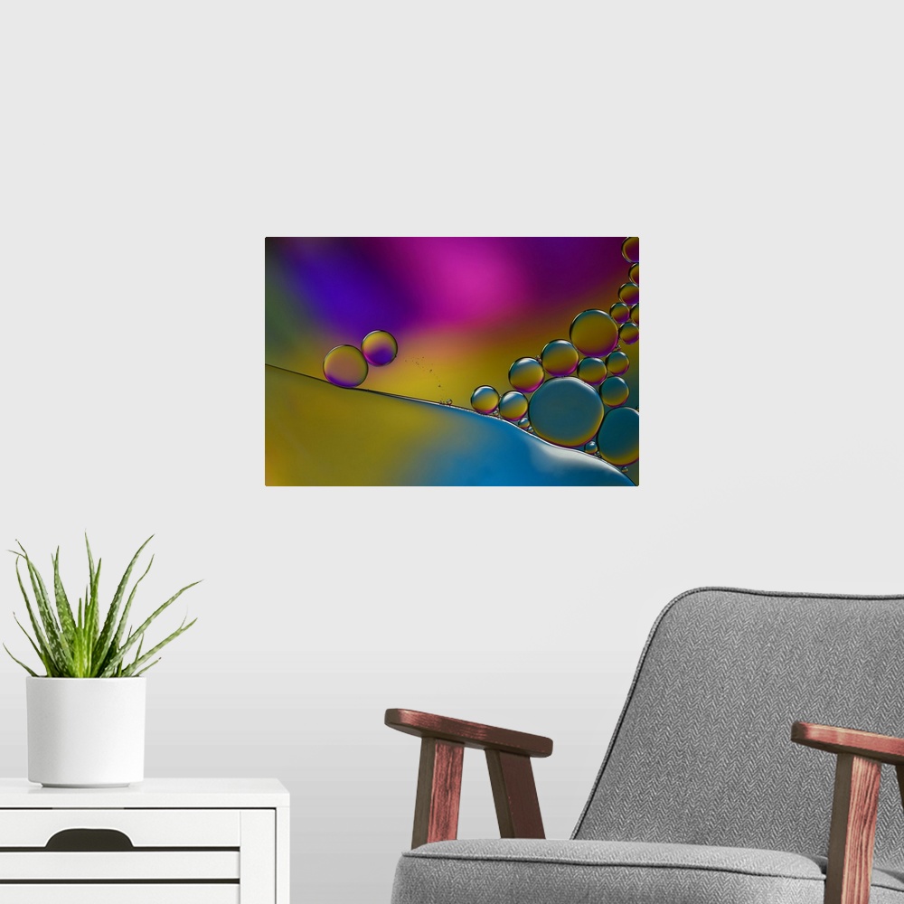 A modern room featuring Abstract photograph of transparent droplets stacked together with blue, yellow, pink, and purple ...