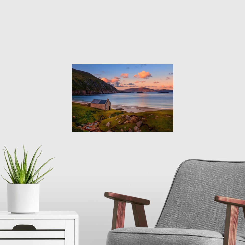 A modern room featuring Peaceful scene of a sunset on an Irish beach