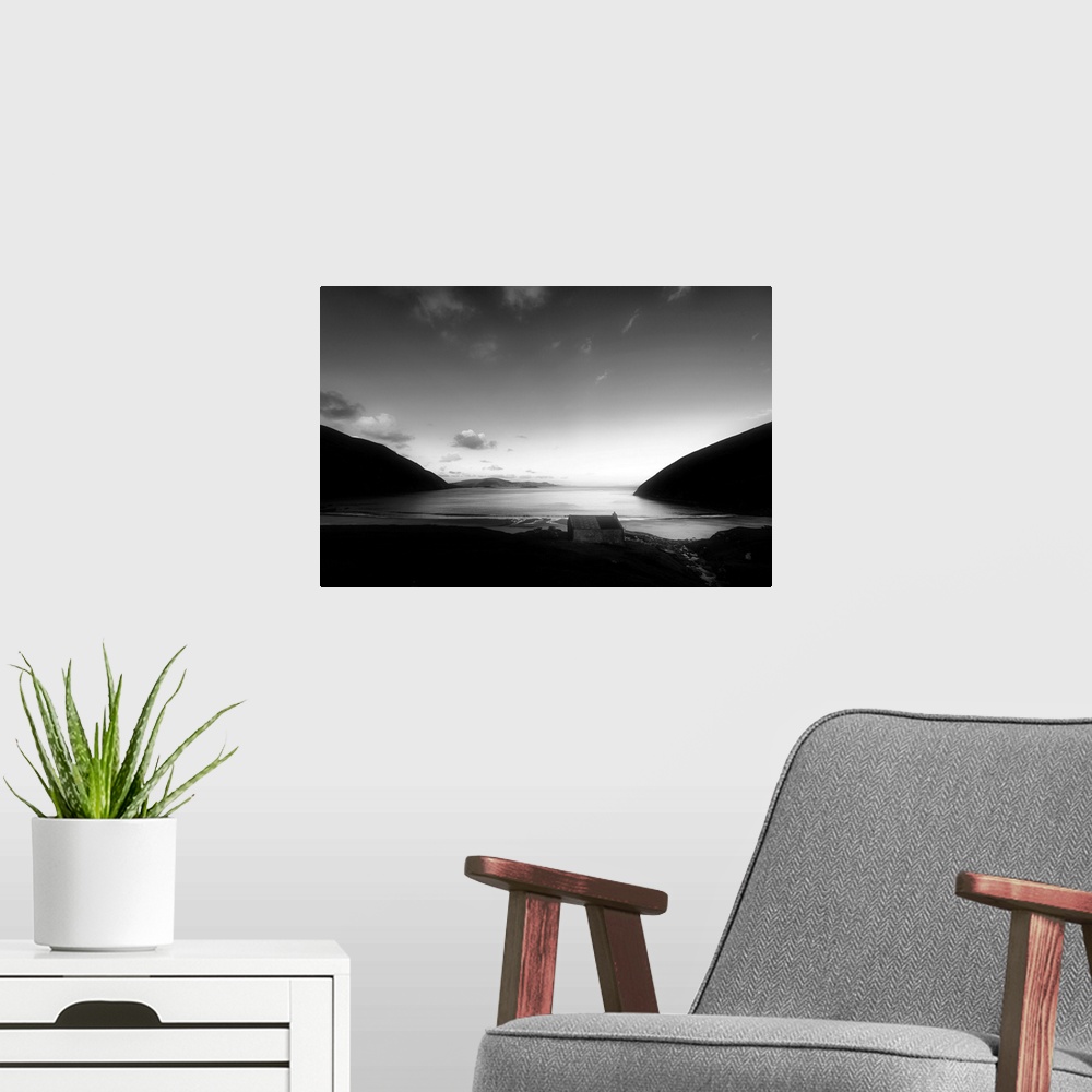 A modern room featuring Black and white landscape of a beach in Ireland
