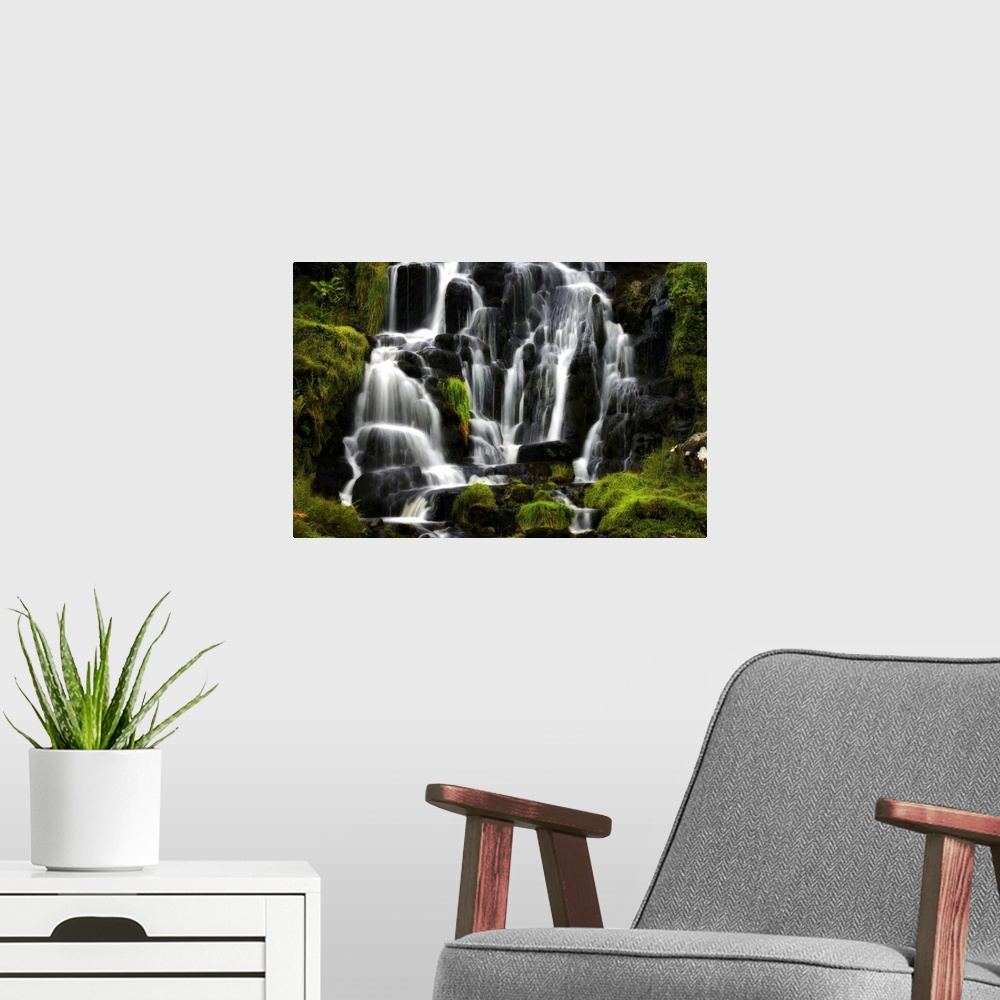 A modern room featuring Fine art photo of a waterfall over several round rocks