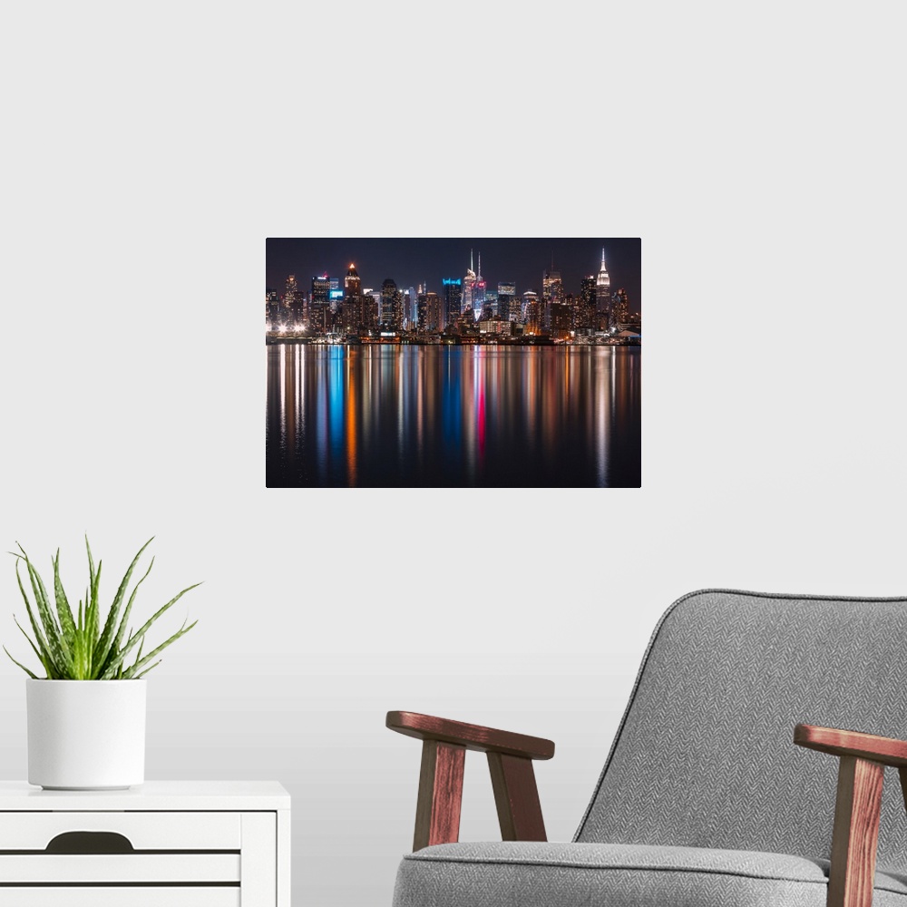 A modern room featuring Long exposure of Manhattan, NYC and its rainbow reflection in the Hudson River.