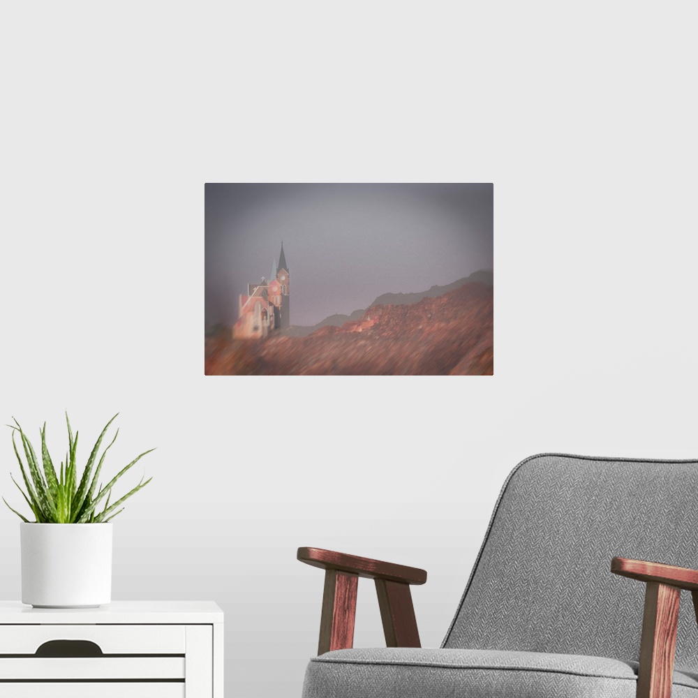 A modern room featuring Multiple exposure image of a Namibian church on a mountain side with light vignetted corners.