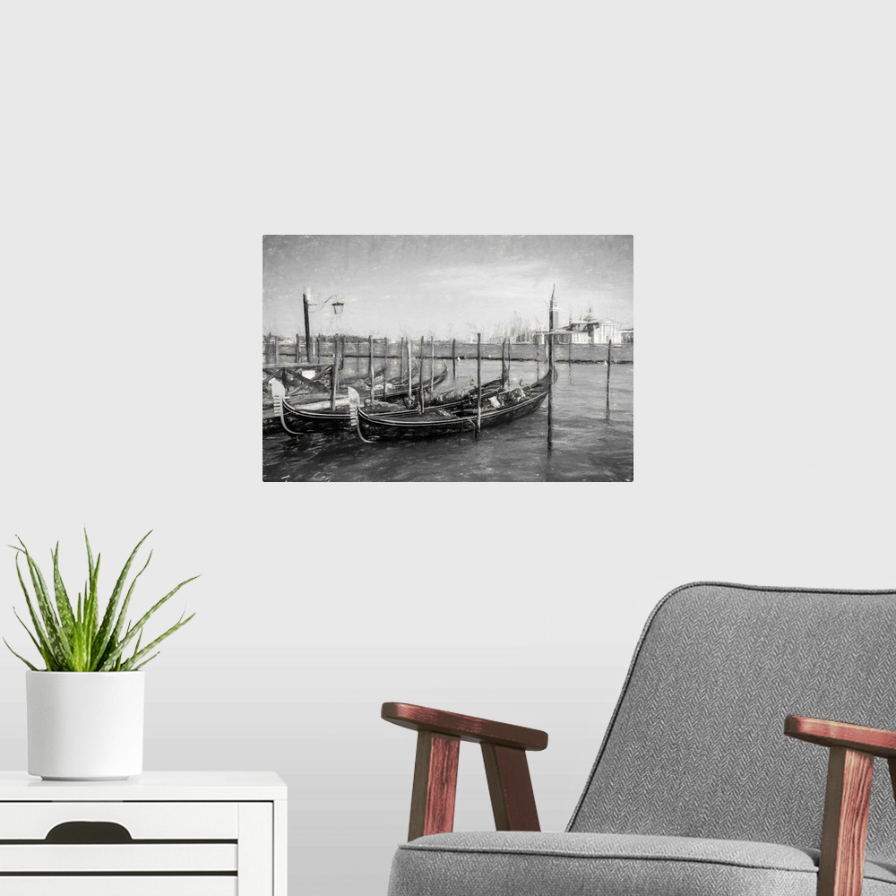 A modern room featuring Fine art photo of gondolas at a dock in Venice, Italy, in black and white.