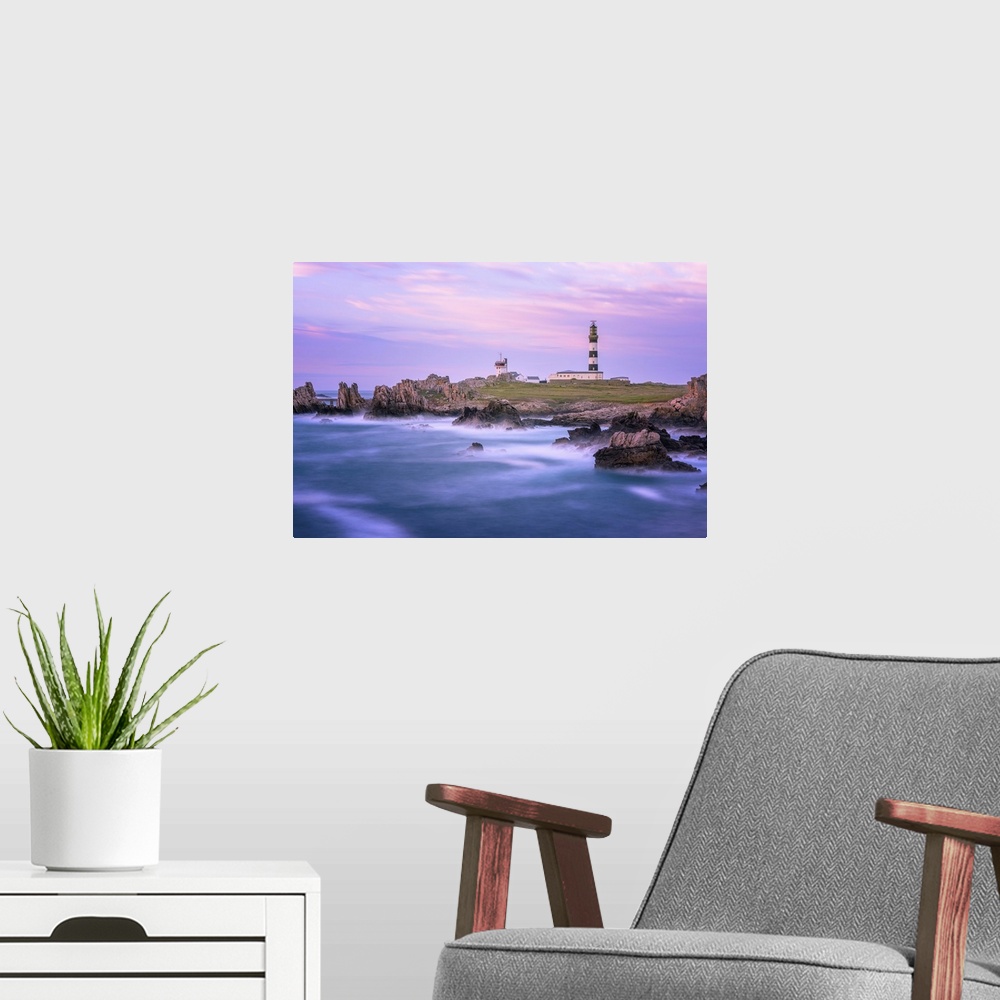 A modern room featuring A coastal landscape with a striped lighthouse in the distance.