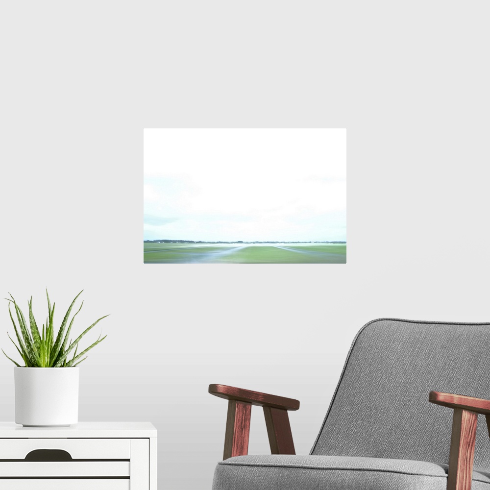A modern room featuring Artistically blurred photo. A land of polders and rivers.