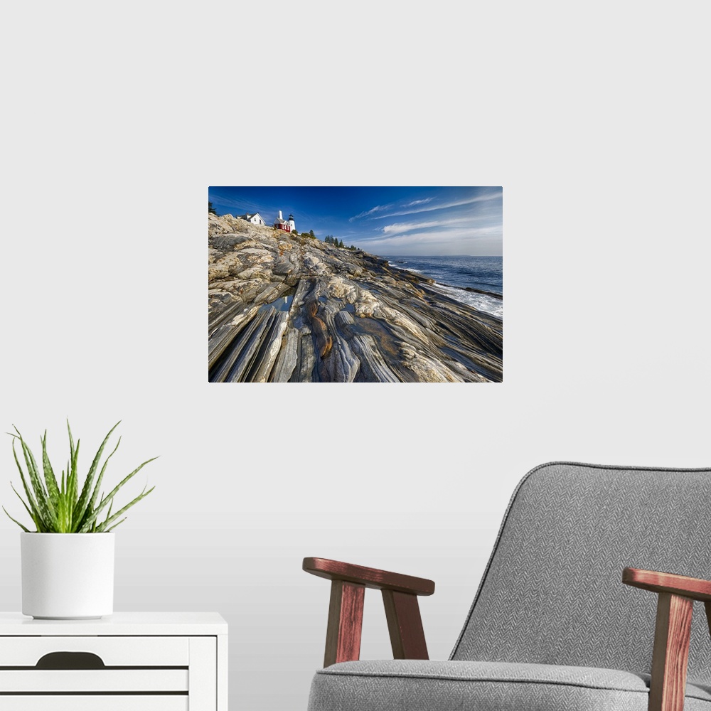 A modern room featuring Low Angle View of a Rocky Shoreline with a Lighthouse, Pemaquid Point, Maine.