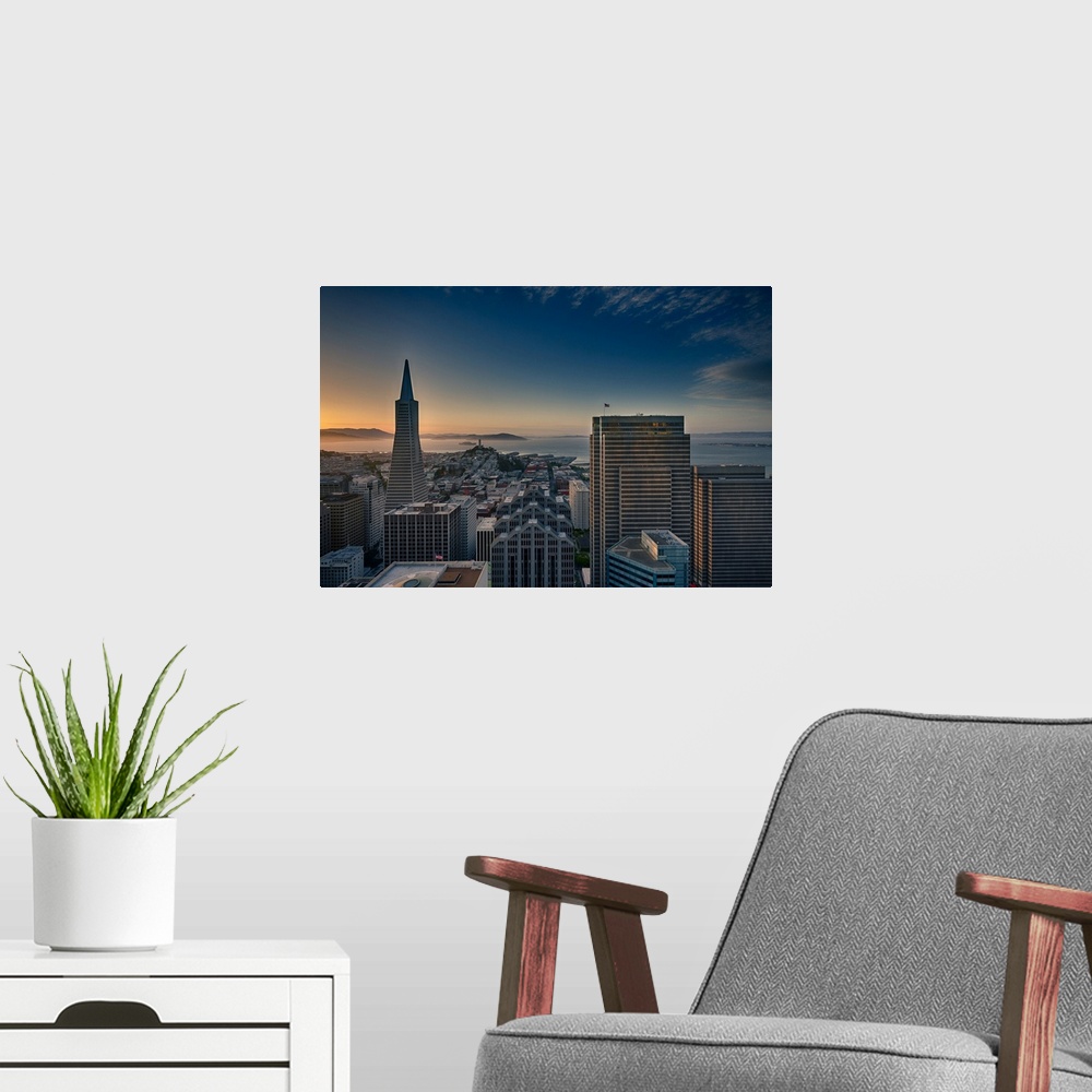A modern room featuring San Francisco Bay view and skyline during sunset seen from Marriott Hotel.
