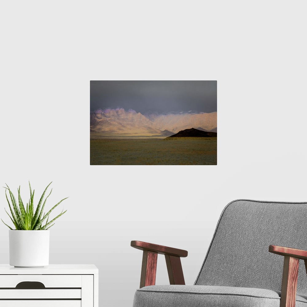 A modern room featuring Abstract photograph of a mountain landscape created with multiple layers.