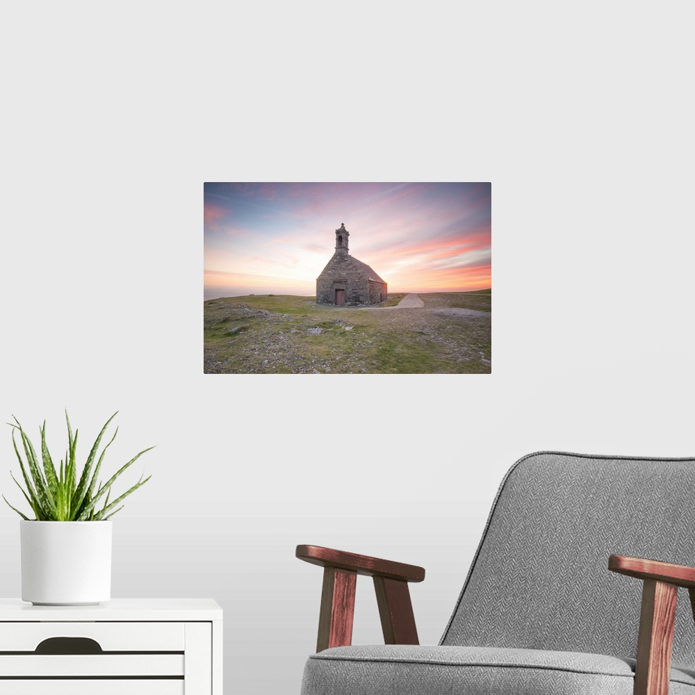 A modern room featuring Pink sweet sunset in Brittany, on little Saint Michel chapel.