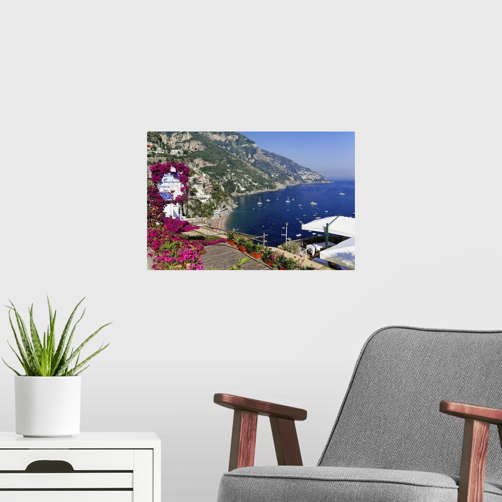 A modern room featuring High Angle View of a Beach and Coast from a Hillside Terrace, Positano