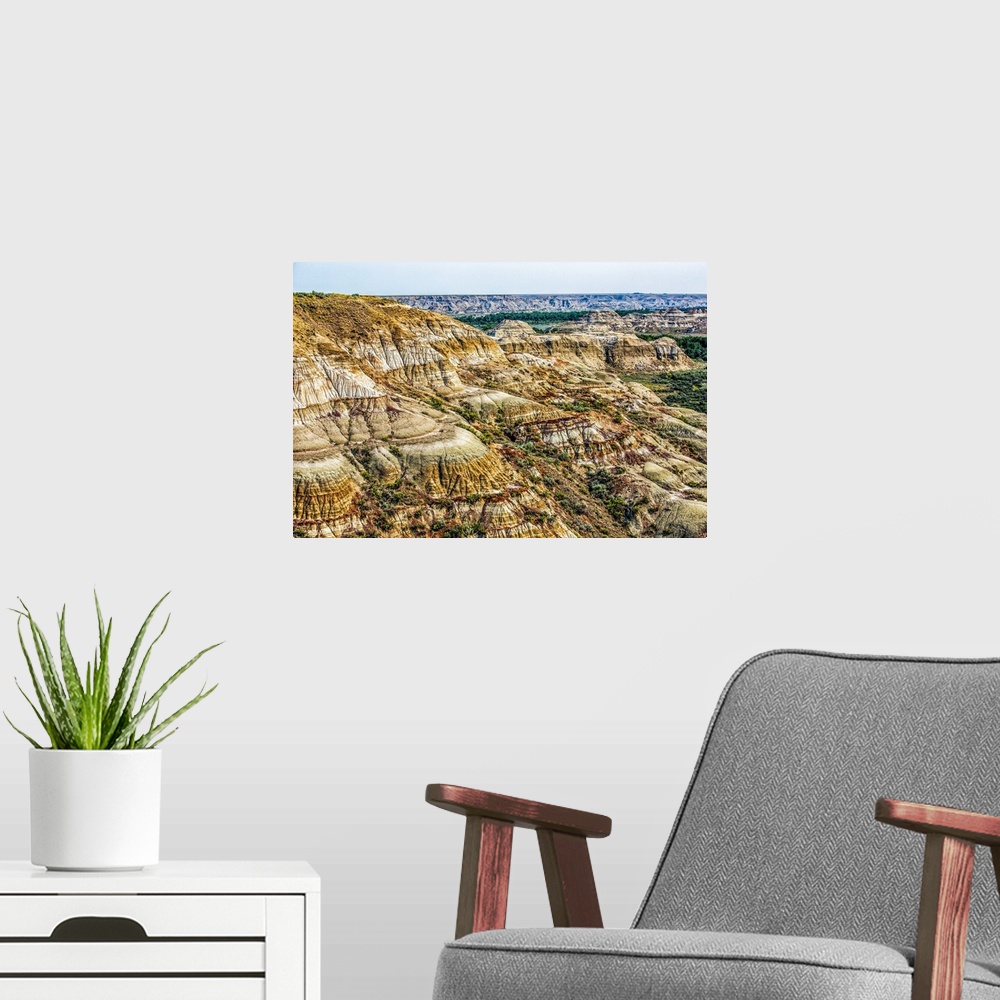 A modern room featuring A scenic view of Alberta's Dinosaur Park.