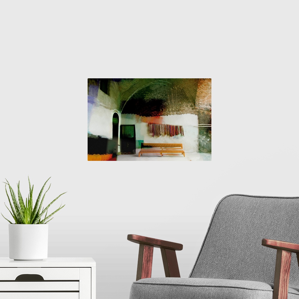 A modern room featuring Altered photograph of building with bundles of yarn hanging on the wall over a bench.
