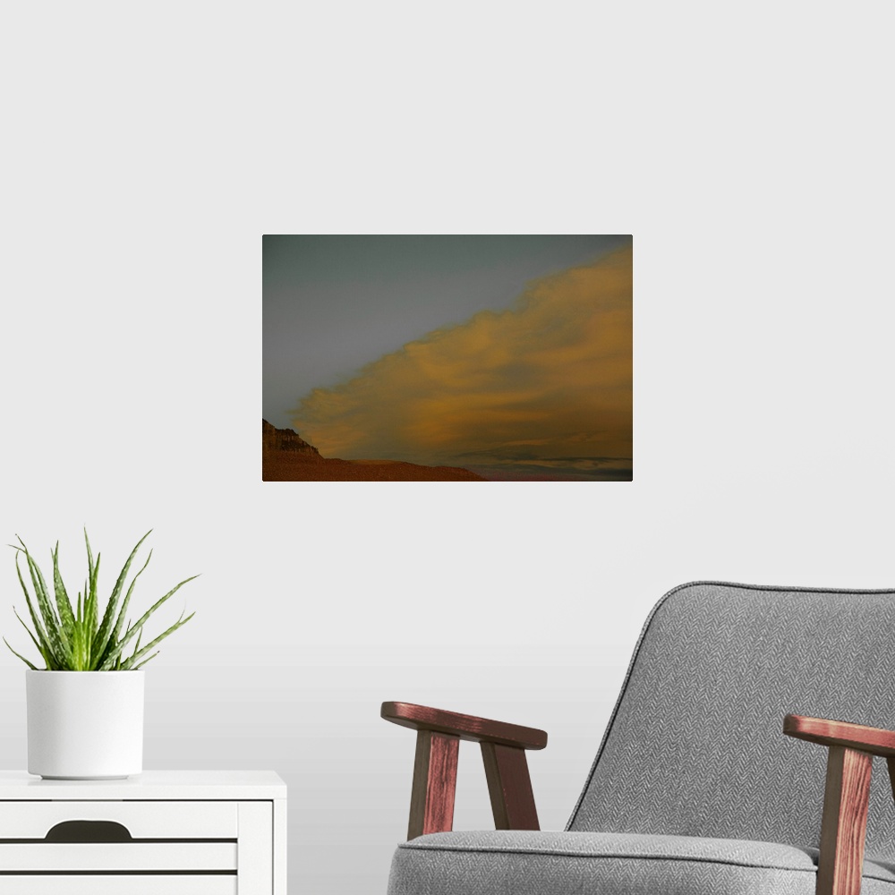 A modern room featuring Abstract landscape photograph representing a desert, sand, and a sandstorm.