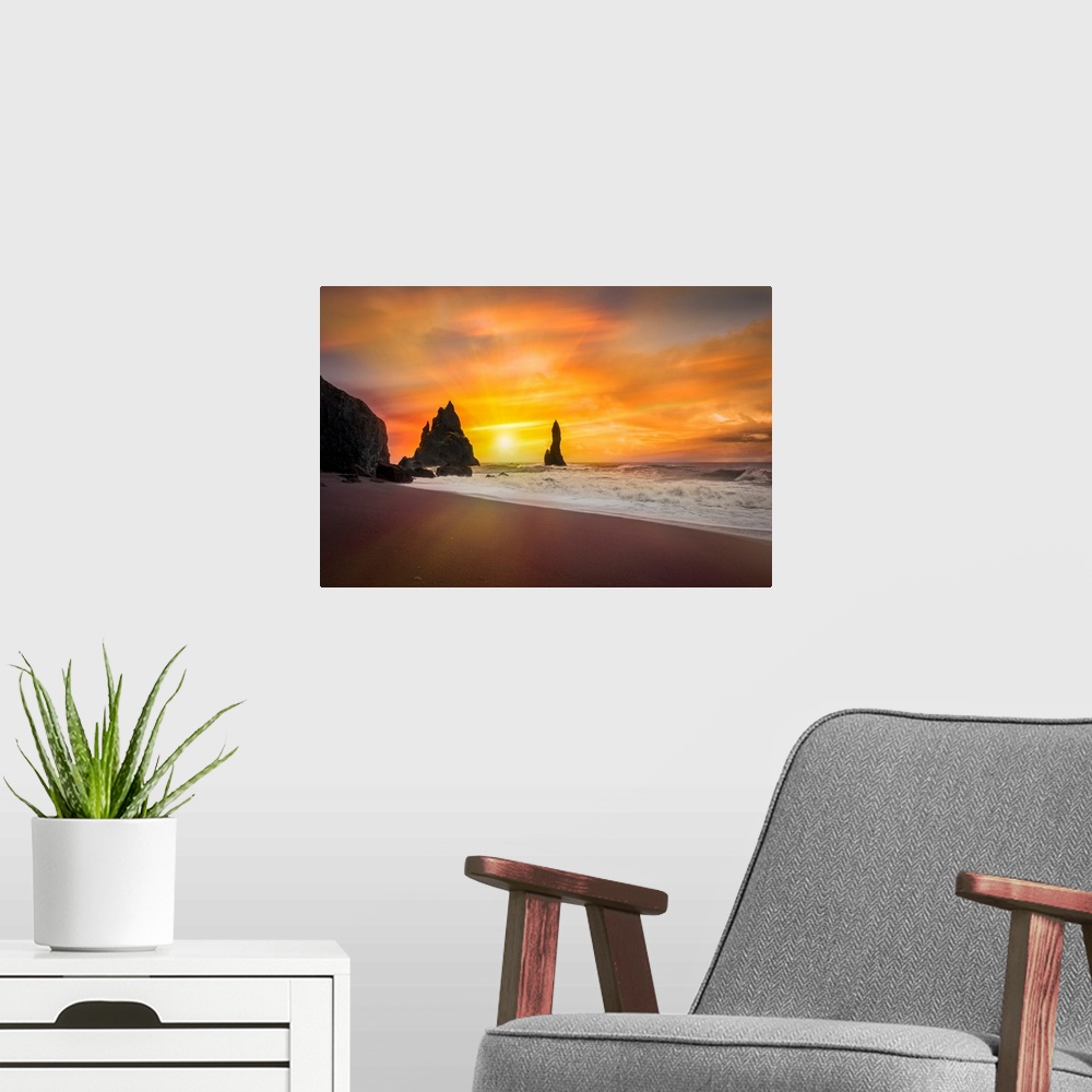 A modern room featuring Fine art photograph of the sun shining over a sandy beach with foamy waves.