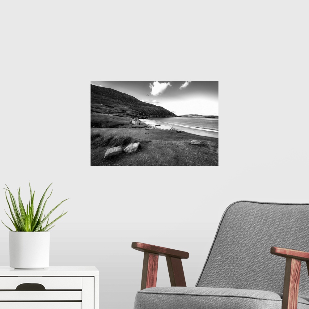 A modern room featuring Black and white photo of a beach in Ireland