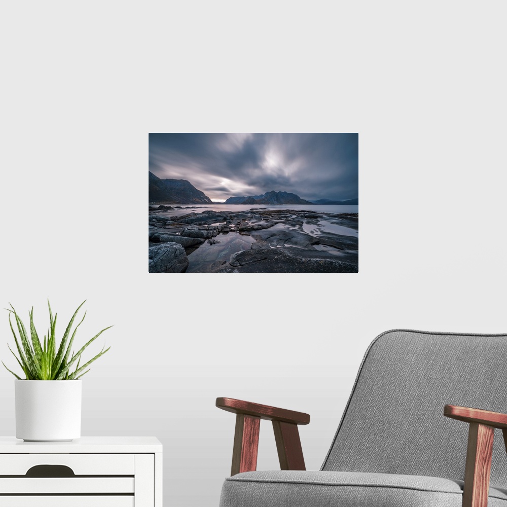 A modern room featuring Dramatic cloud movement from long exposure in central Lofoten islands, an archipelago within the ...