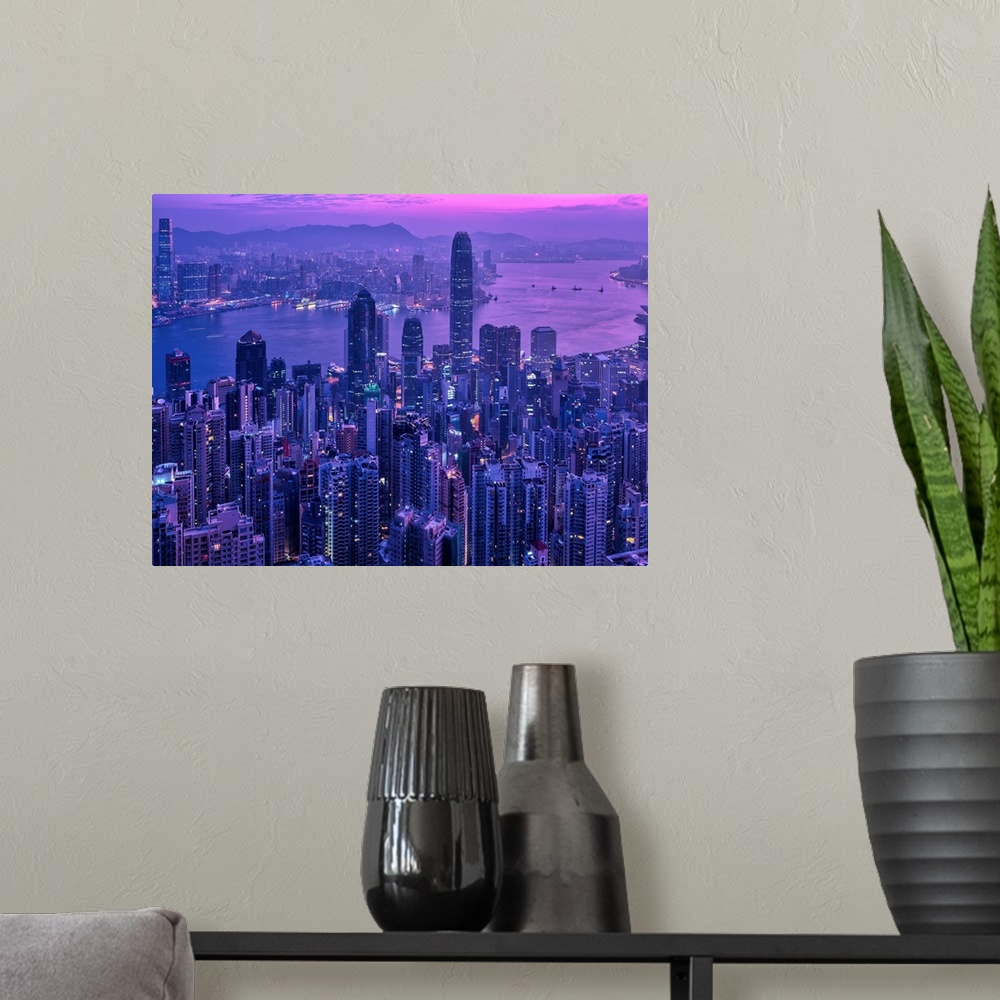 A modern room featuring Ariel view of the city of Hong Kong, China at sunset.