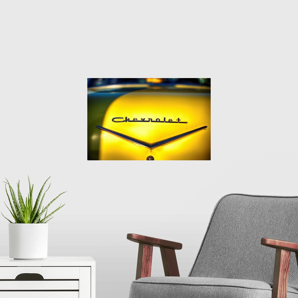 A modern room featuring A photo of vintage Chevrolet metal emblem.