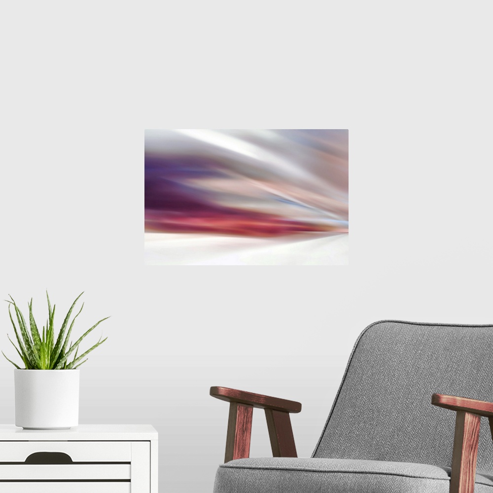 A modern room featuring Abstract view of a gentle sunset by a white sands beach.