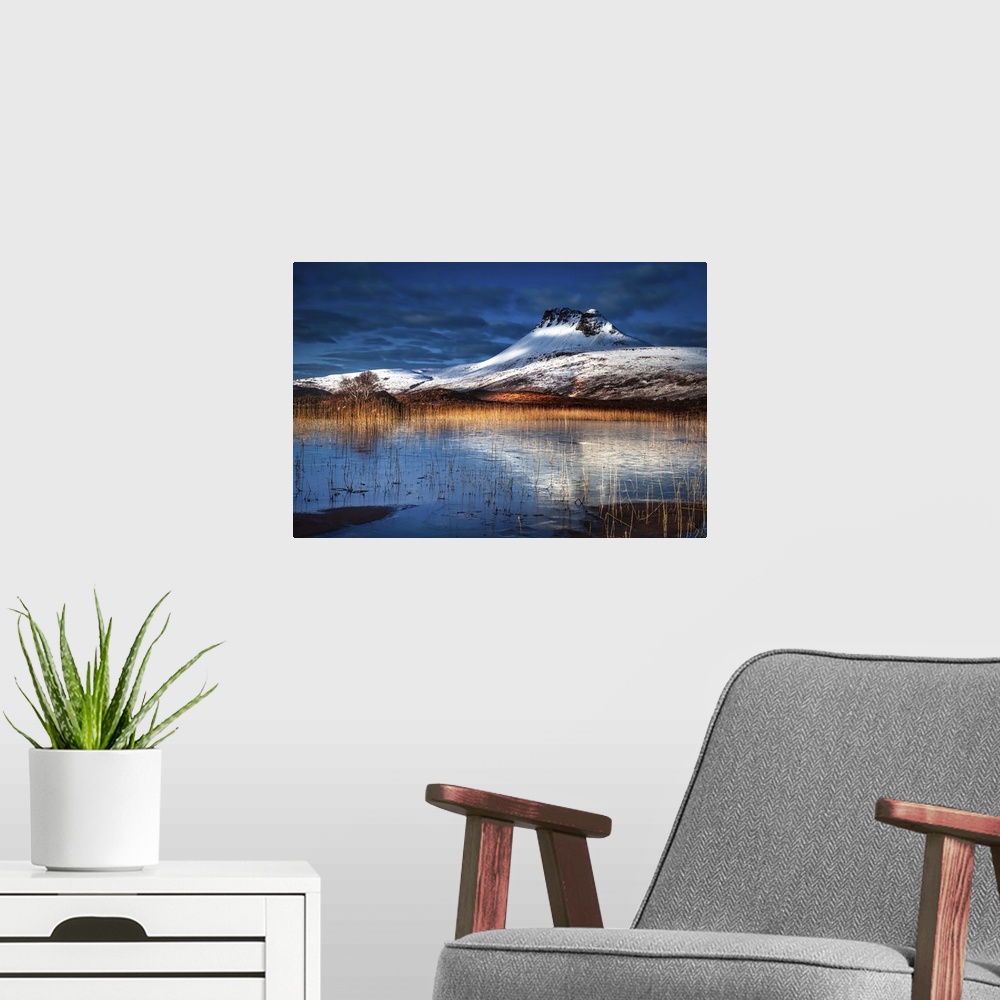 A modern room featuring Dramatic snow on mountains in winter in the Scottish Highlands.