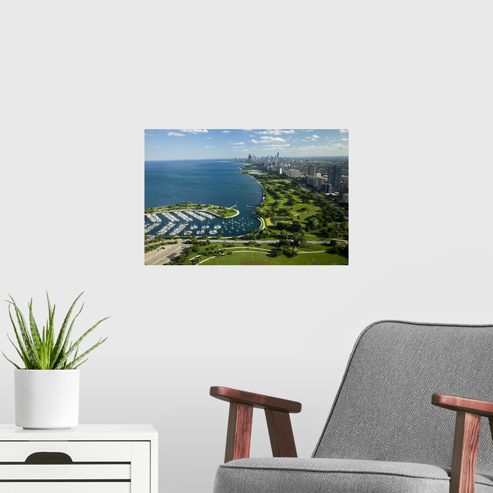 A modern room featuring This high angle photograph is taken from a distance of Chicago and most of the lake shown to the ...