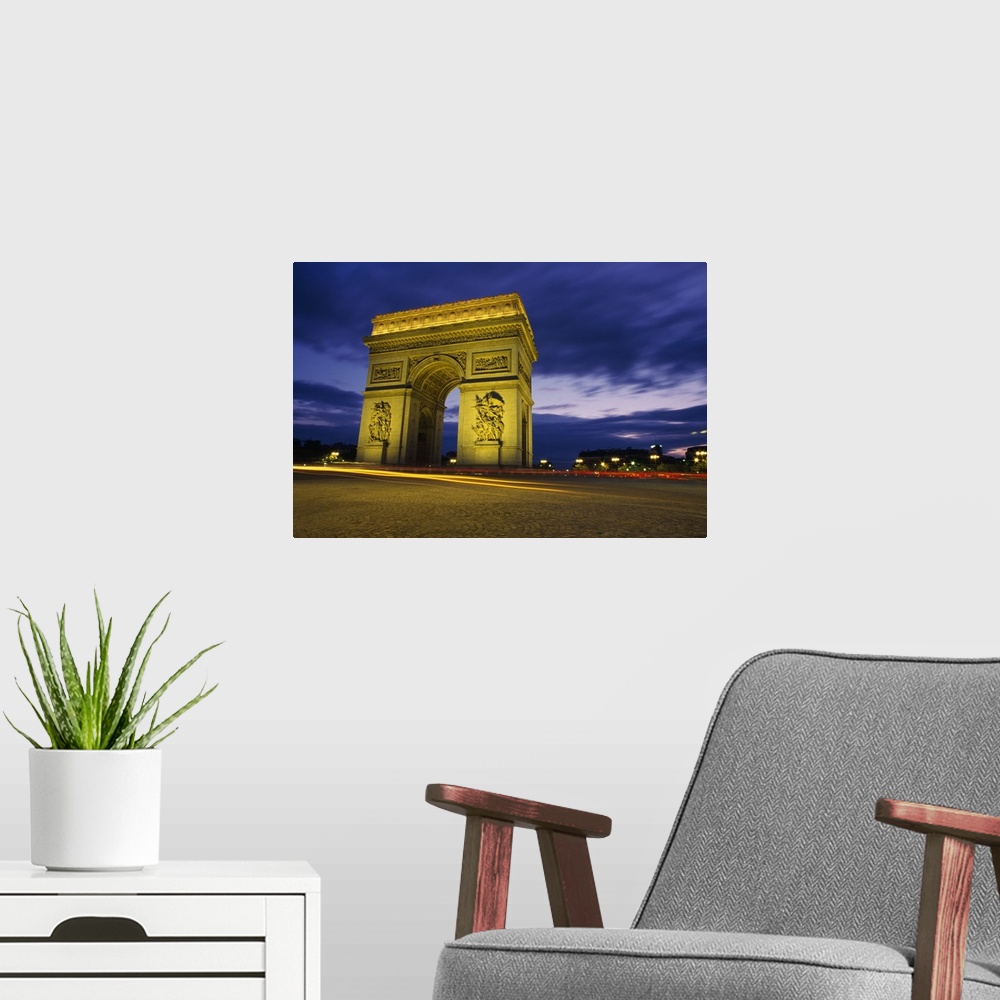 A modern room featuring Arc De Triomphe Illuminated At Night