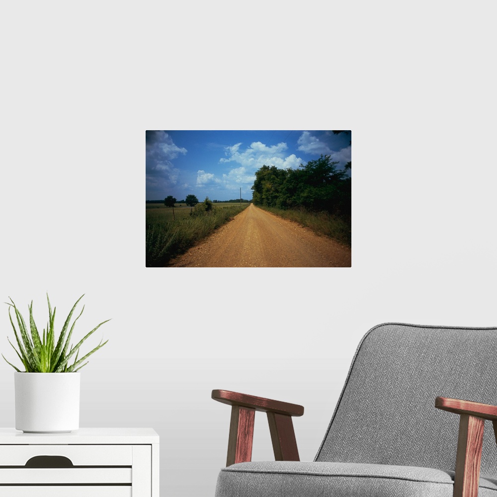 A modern room featuring Gravel road passing through a field, Arkansas