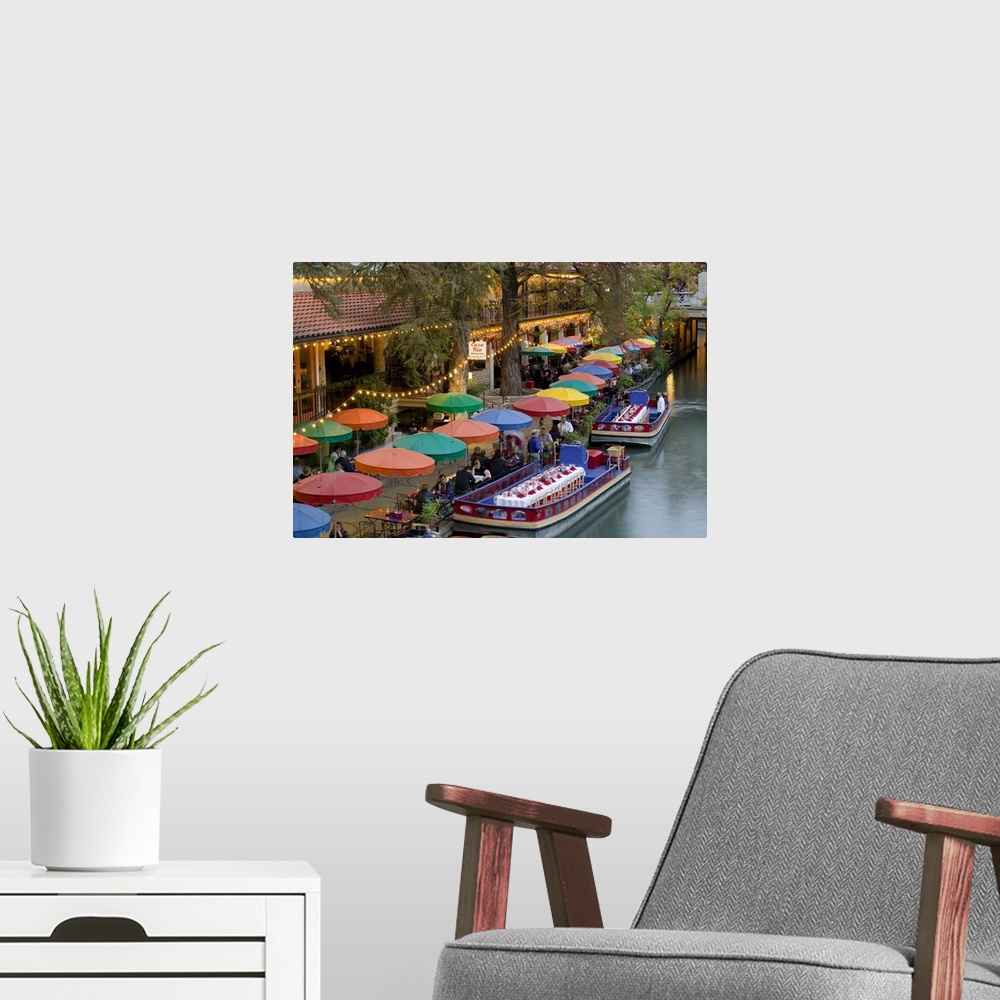 A modern room featuring Large photo on canvas of colored umbrellas along a waterfront with boats with tables and chairs d...