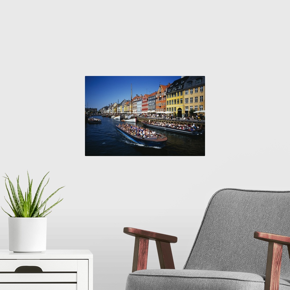 A modern room featuring High angle view of tourists on a boat in a river, Nyhavn, Copenhagen, Denmark