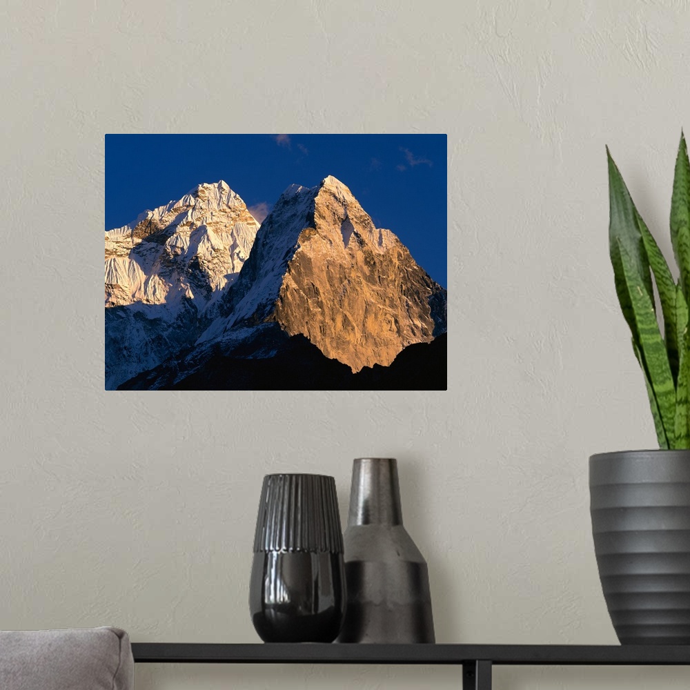 A modern room featuring Nepal, Ama Dablam, Sunlight over the mountain peak