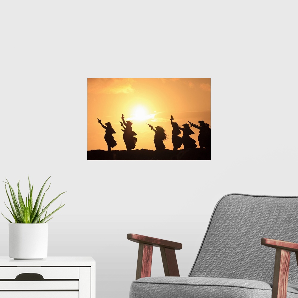 A modern room featuring Wall docor of hula dancers silohuetted against a rising sun.