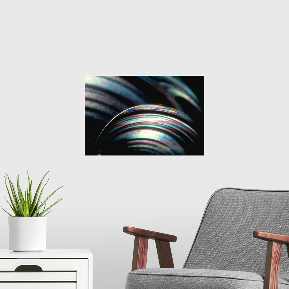 A modern room featuring This large piece shows a very close up shot of bubbles with an array of colors swirling throughout.