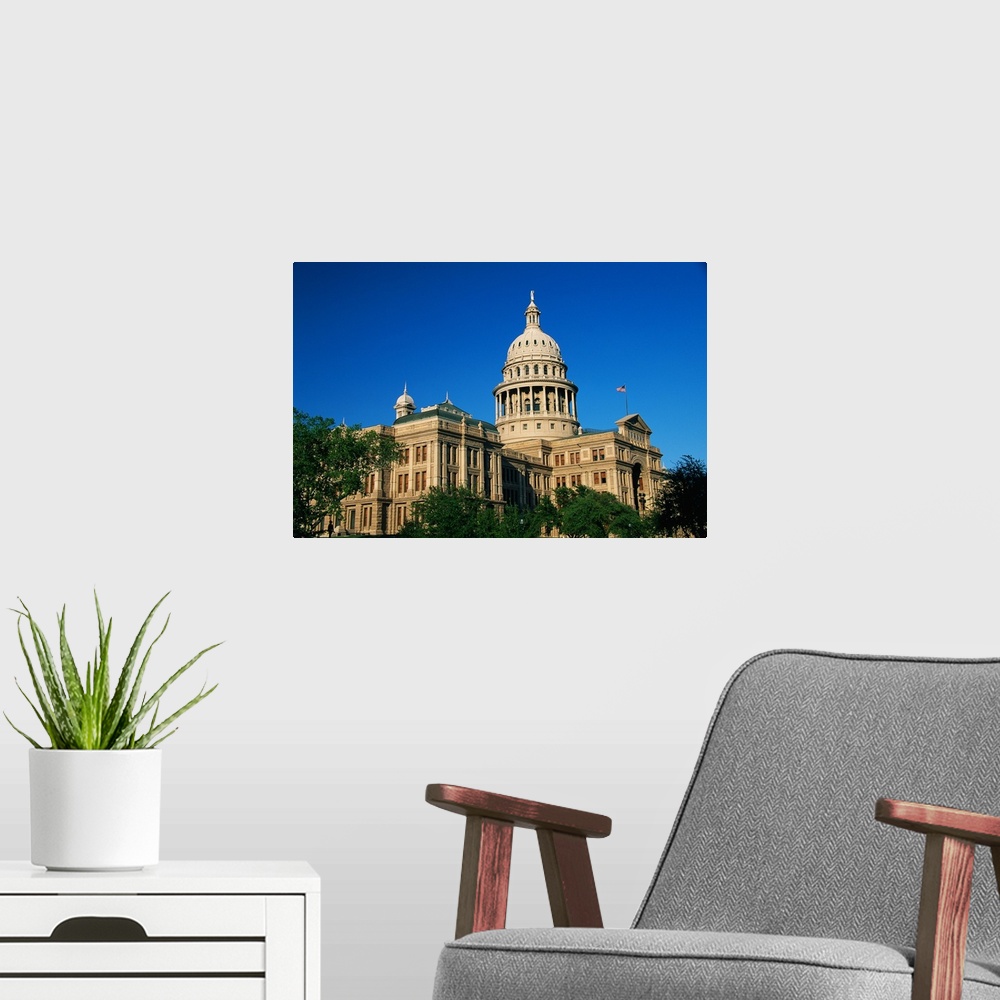 A modern room featuring Landscape photograph of the state capitol building against a bright blue sky, in Austin, Texas.