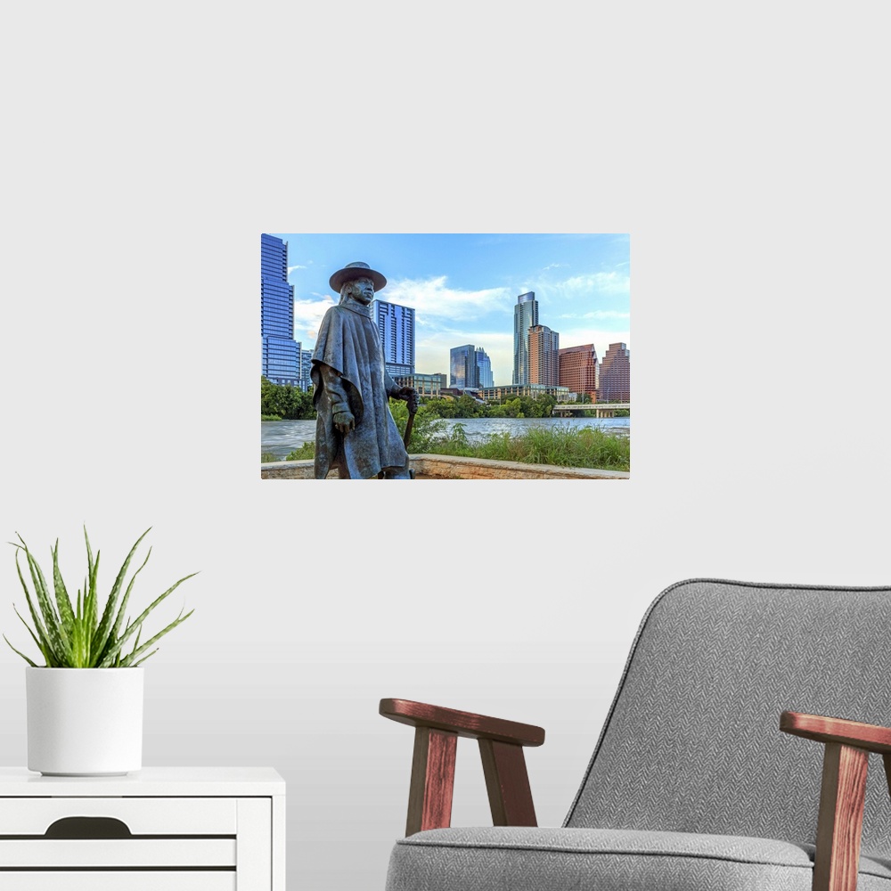 A modern room featuring Statue of Stevie Ray Vaughan on the shore of Lady Bird Lake in downtown Austin, Texas, USA.