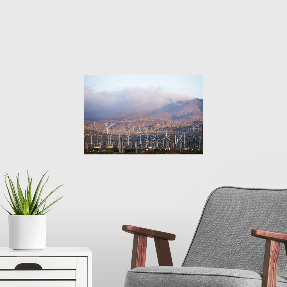 A modern room featuring Wind turbines with mountains in the background, Riverside County, California