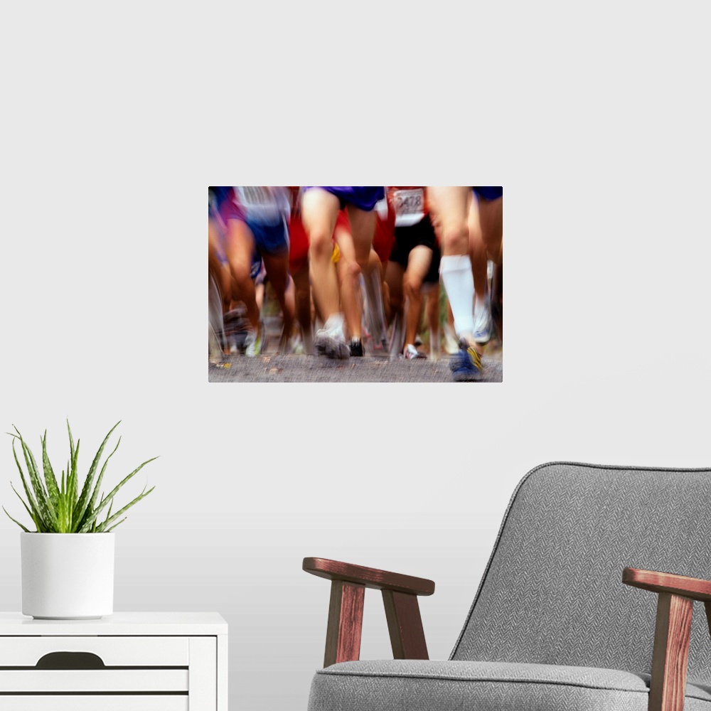 A modern room featuring Blurred action of runner's legs competing in a race