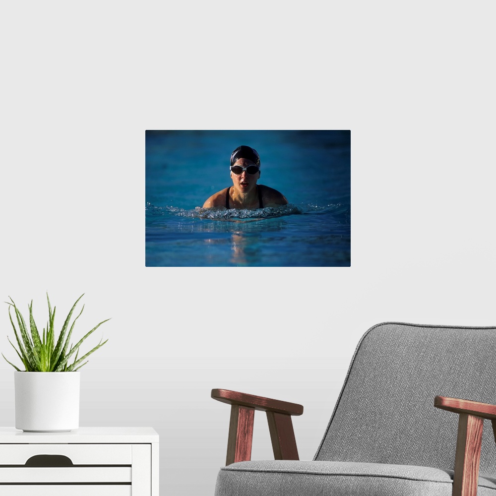 A modern room featuring Female swimmer in action