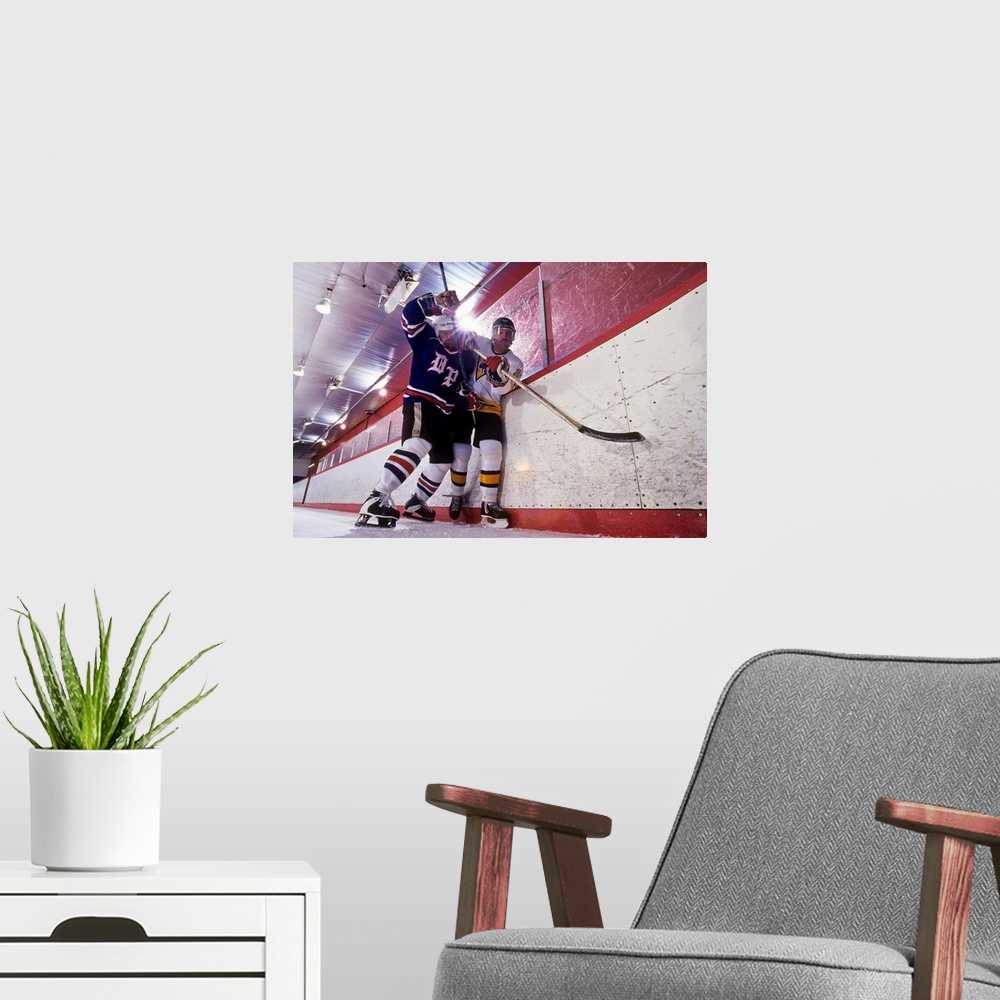 A modern room featuring Ice hockey players checking