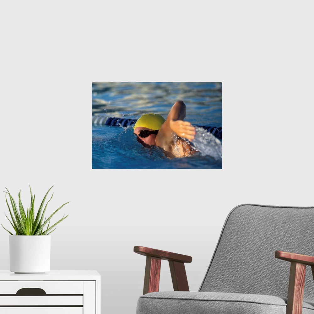 A modern room featuring Male swimmer in action