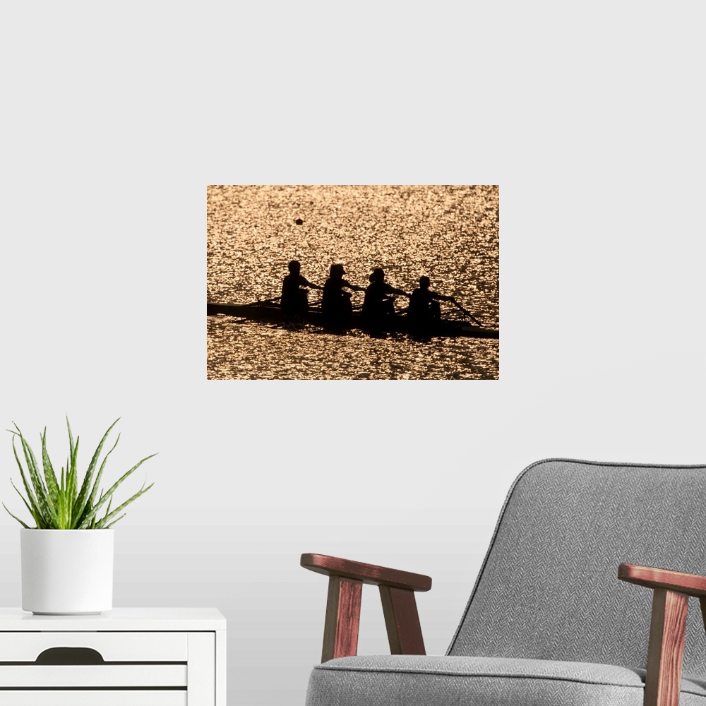 A modern room featuring Silhouette of women's fours rowing team
