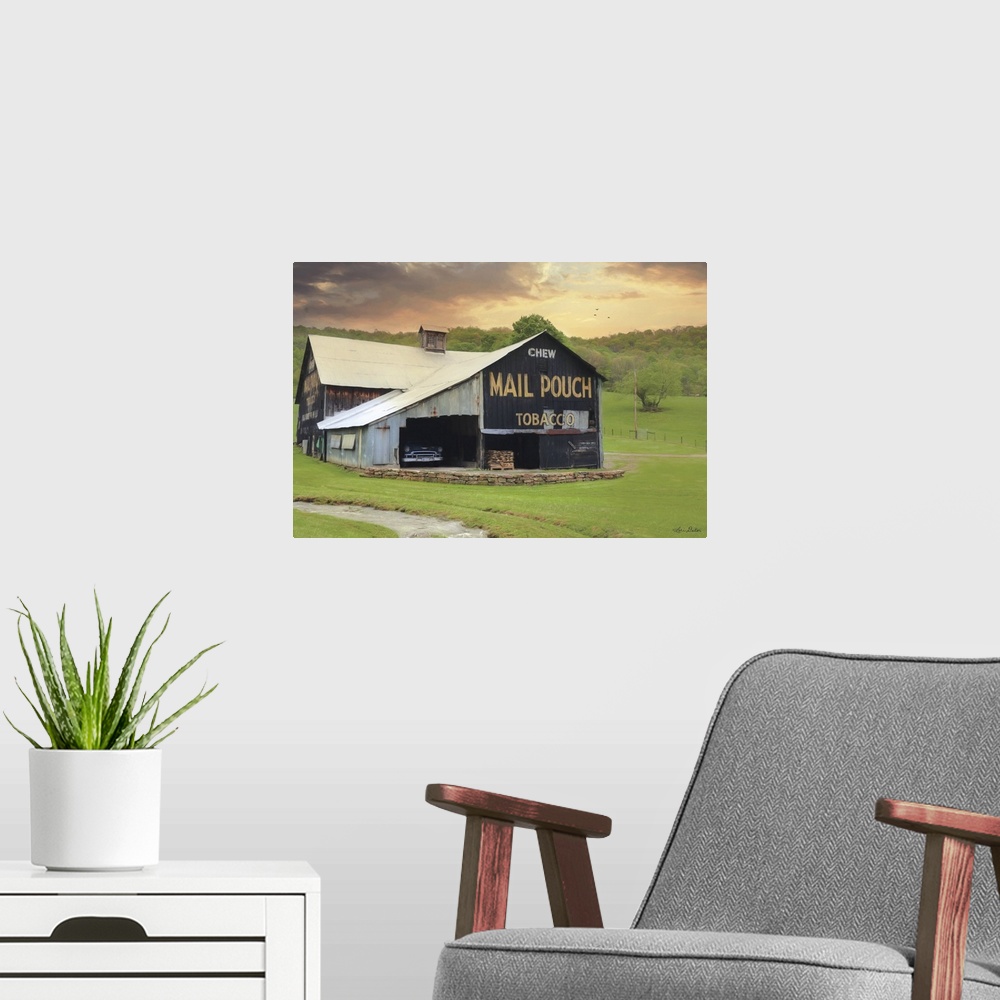 A modern room featuring Photograph of a worn building on a countryside landscape.
