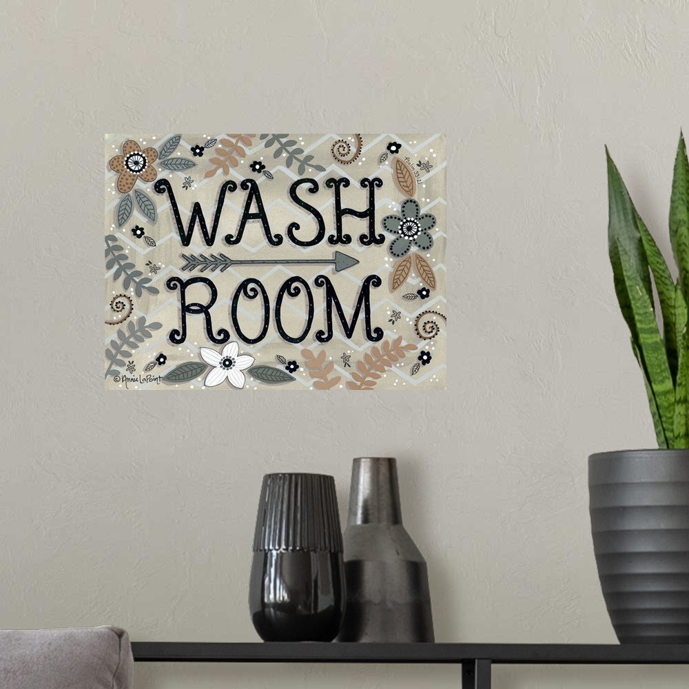 A modern room featuring A folk art style sign with flowers and leaves with "Wash Room" in a curly font.