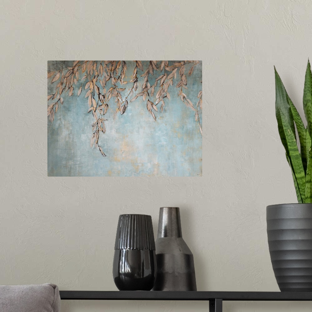 A modern room featuring Contemporary painting of a gold leaves hanging against a pale blue background.