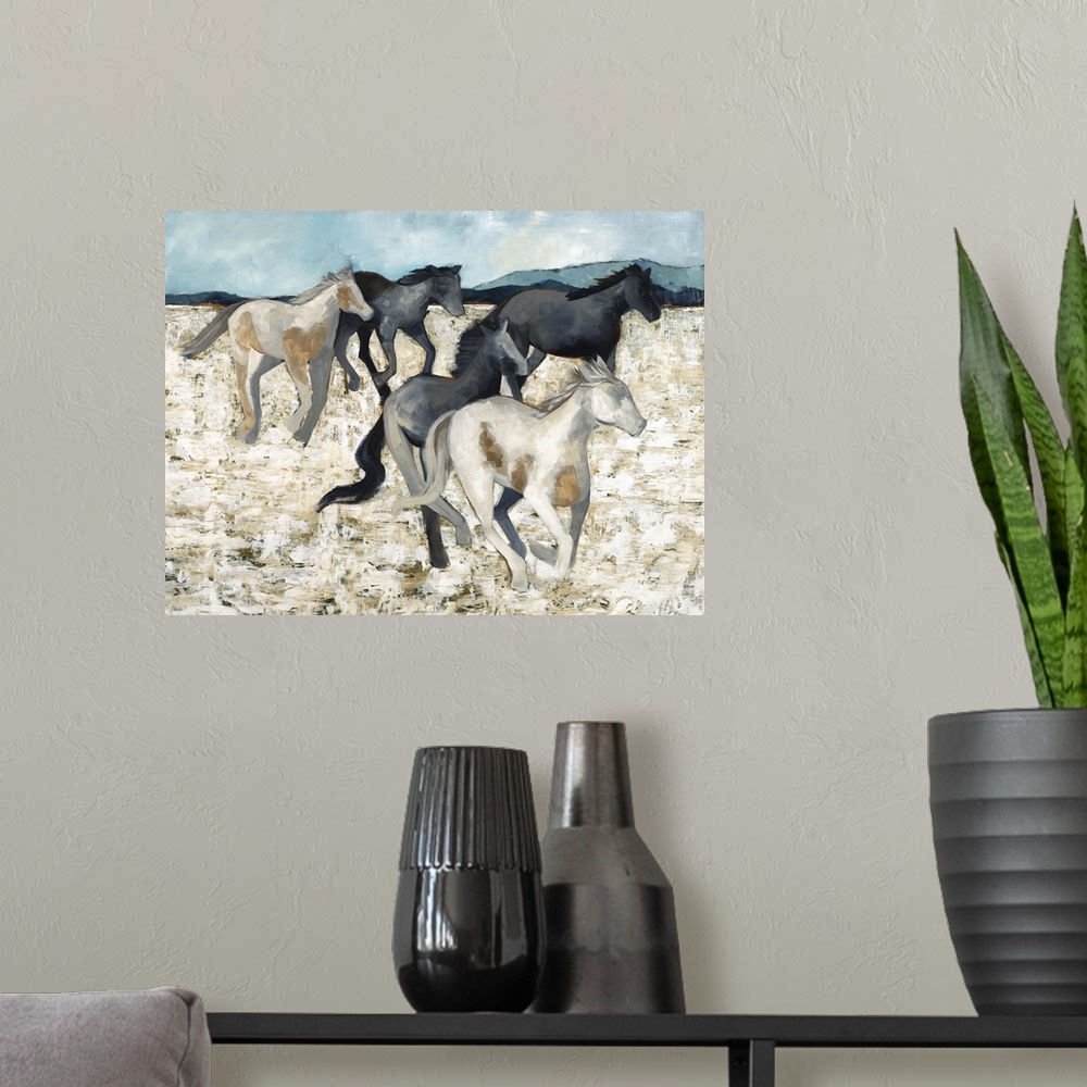 A modern room featuring Contemporary painting of a herd of galloping horses.
