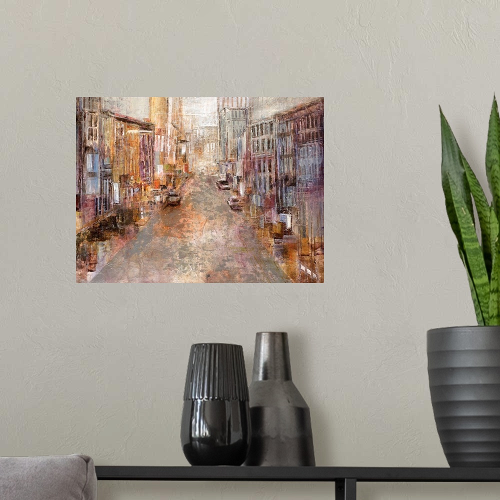 A modern room featuring A contemporary piece of artwork with multicolored buildings lining a street that goes back toward...