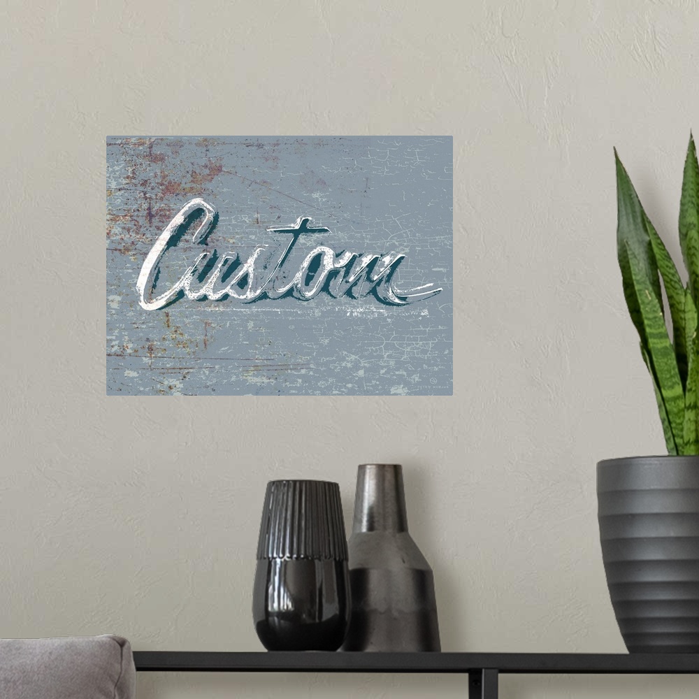 A modern room featuring Graphic rusty wall art of distressed typography with the the word Custom large and in center on a...